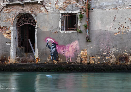 A mural depicting a child with a pink neon coloured flare