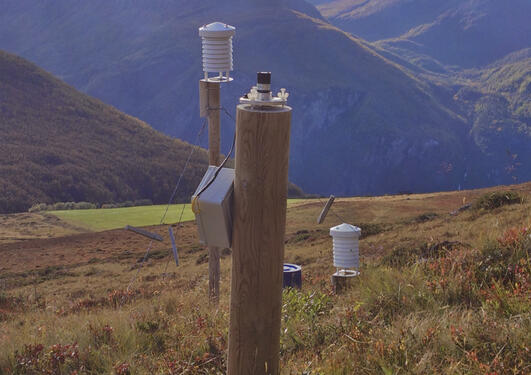 A wooden post with different instruments to measure incoming solar radiation