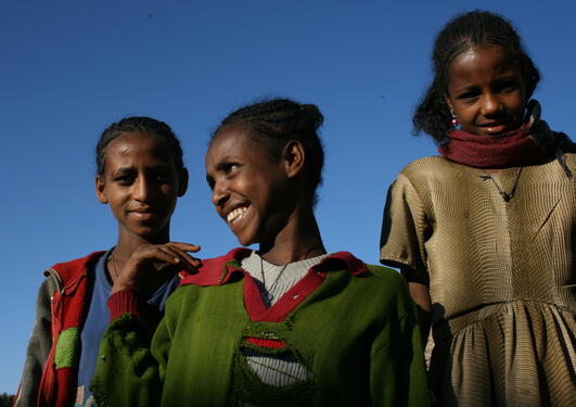 Illustration photo of three young African women, used to illustrate article about University of Bergen's collaboration with African universities.