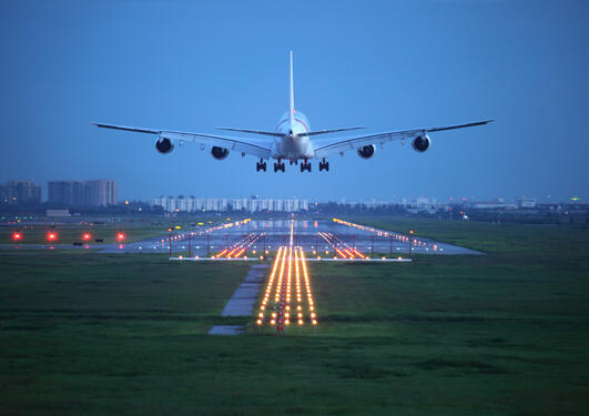 Airplane landing in the evening