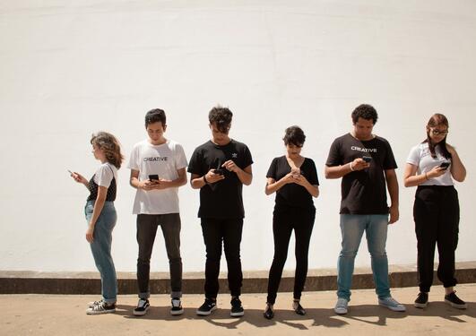 image of young people with phones