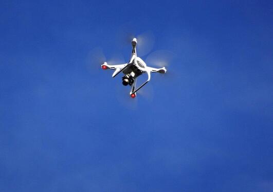 drone flying in blue sky
