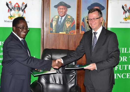 Makerere University’s Vice-Chancellor John Ddumba-Ssentamu (left) and University of Bergen's Rector Dag Rune Olsen shake hands after signing a new 10 year frame agreement between the two universities on 30 September 2014.