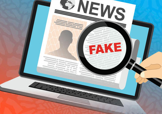 Illustration of a pc screen with a newspaper in it, and a magnifying glass with the text Fake News.