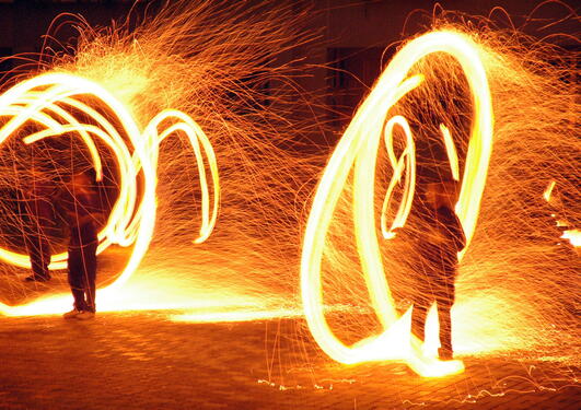 People twirling rings of fire