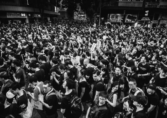 Black and white photo of a mass of people at the Hong Kong protest