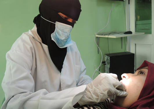 Dentist and patient in the clinic.