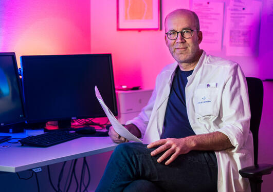 Oddbjørn Straume sitting in his office.