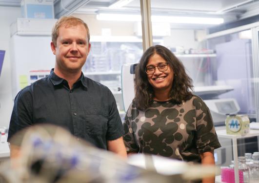 Justas Zalieckas and Sushma Grellscheid standing in laboratory