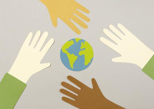 Hands around a globe