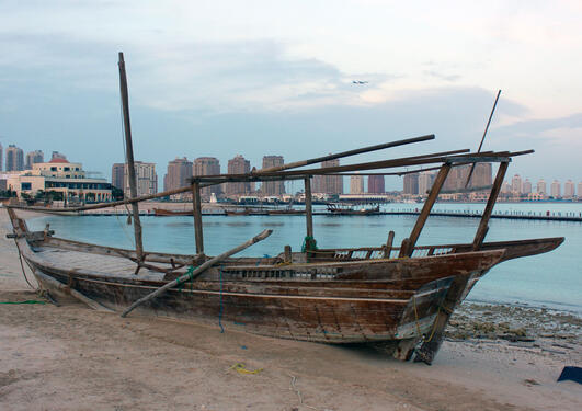 A dhow in front of the skyline of Doha, Qatar