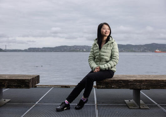 Yan Li by the shore in Bergen, known as "the capital of the fjords".