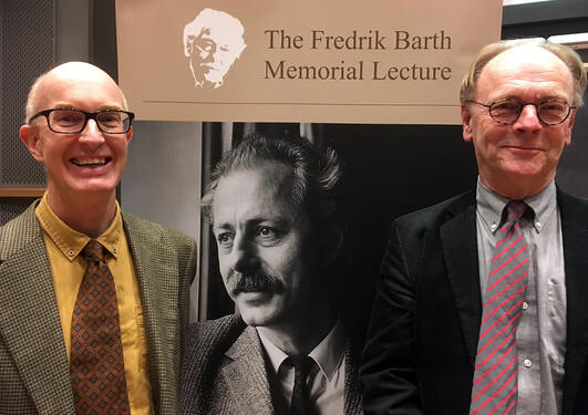 Dr. Scott and Prof. Smedal in front of Fredrik Barth roll-up