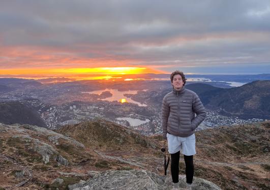 Student hiking mountain