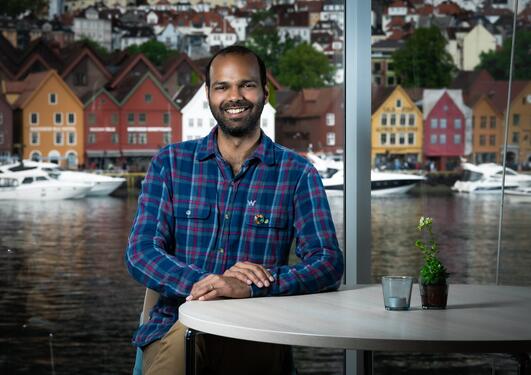 Portrait of Siddharth Sareen in front of Bryggen in Bergen