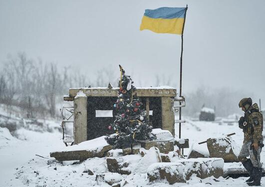 Under constant shelling amidst destruction at the place of the former checkpoint along the road to Bakhmut, Ukrainian defenders set up an elegant Christmas tree. Ву Konstantin and Vlada Liberovs