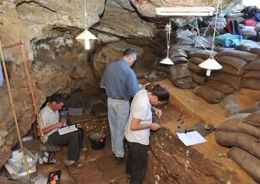 Researchers and from the TRACSYMBOLS project working in Blombos Cave, South Africa.