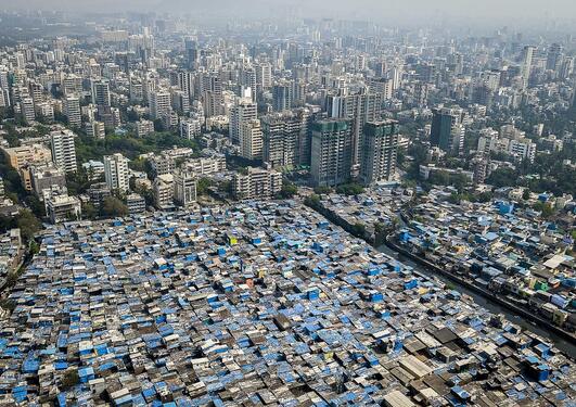 City landscape showing inequality between poor and rich areas in a sprawling metropolis.