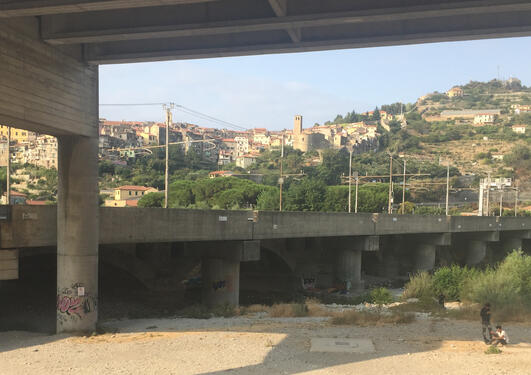 Two irregular migrants under a highway bridge in Vintimiglia