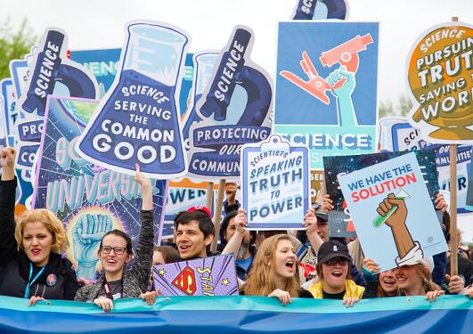 Demonstrators with placards about science
