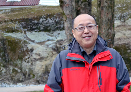 Dr. Zhaou Shouhui outside the Department f Foreign Languages.
