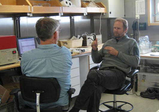 Rolf Pedersen and Eric Olson discuss search strategies. 